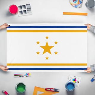 A mockup of the custom flag 'GReatnorth flag' held up on a table during print checking