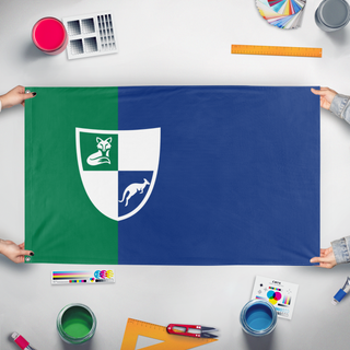 A mockup of the custom flag 'Merovian Flag' held up on a table during print checking