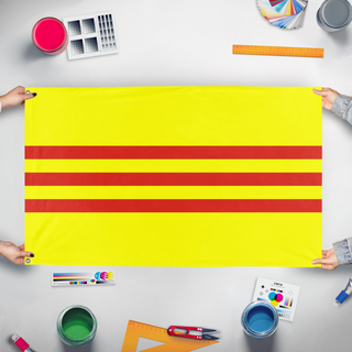 A mockup of the custom flag 'State of Vietnam flag' held up on a table during print checking