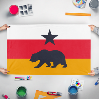 A mockup of the custom flag 'Pacific States Bear flag' held up on a table during print checking
