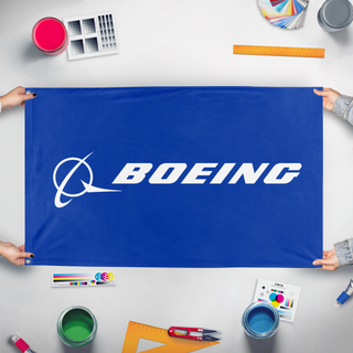 A mockup of the custom flag 'Improved Boeing flag' held up on a table during print checking