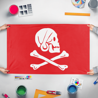 A mockup of the custom flag 'Henry Thew Pirate flag' held up on a table during print checking