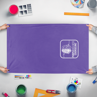 A mockup of the custom flag 'PWC flag' held up on a table during print checking