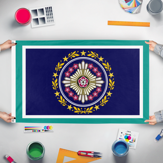 A mockup of the custom flag 'Blossom star flag' held up on a table during print checking