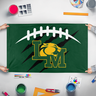 A mockup of the custom flag 'LMFB flag' held up on a table during print checking