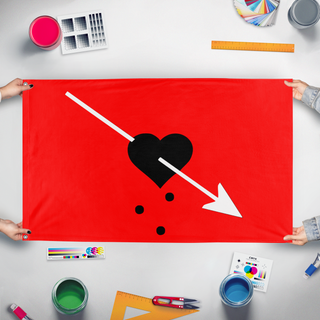 A mockup of the custom flag 'Bleeding Heart PPirate Flag' held up on a table during print checking