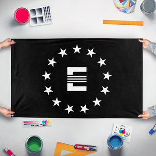A mockup of the custom flag 'Enclave flag' held up on a table during print checking