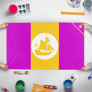 A mockup of the custom flag 'Manzania flag' held up on a table during print checking