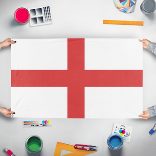 A mockup of the custom flag 'T flag' held up on a table during print checking