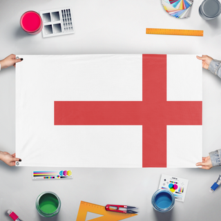 A mockup of the custom flag 'T flag' held up on a table during print checking