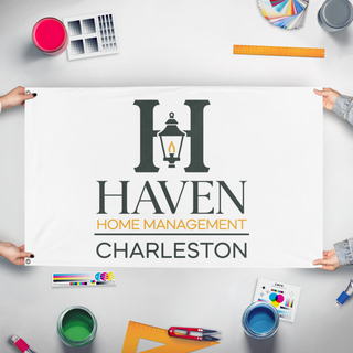 A mockup of the custom flag 'Haven flag' held up on a table during print checking