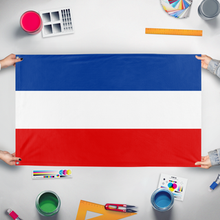 A mockup of the custom flag 'Kingdom Of Yugoslavia flag' held up on a table during print checking