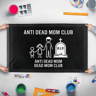 A mockup of the custom flag 'moms_dead flag' held up on a table during print checking