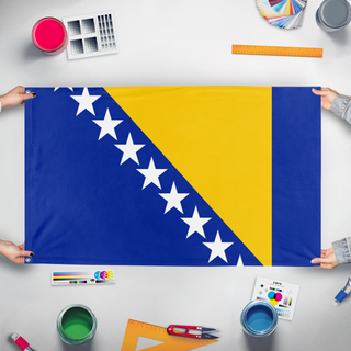 A mockup of the custom flag 'test flag' held up on a table during print checking