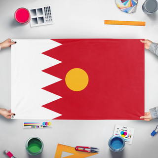 A mockup of the custom flag 'test flag' held up on a table during print checking