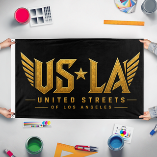 A mockup of the custom flag 'USofLA flag' held up on a table during print checking