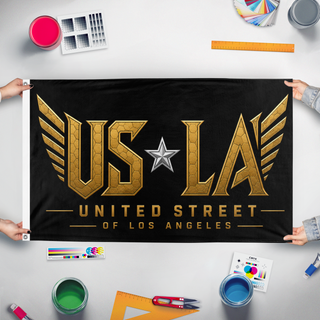 A mockup of the custom flag 'USofLA flag' held up on a table during print checking