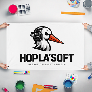 A mockup of the custom flag 'HOPLA'SOFT flag' held up on a table during print checking