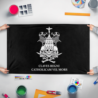 A mockup of the custom flag 'Catholicam vel mors flag' held up on a table during print checking