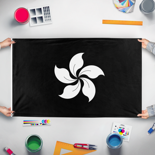 A mockup of the custom flag 'Black Bauhinia flag' held up on a table during print checking