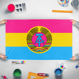 A mockup of the custom flag 'East German Pansexual flag' held up on a table during print checking