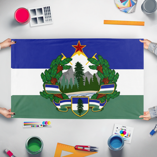 A mockup of the custom flag 'Socialist Cascadia flag' held up on a table during print checking