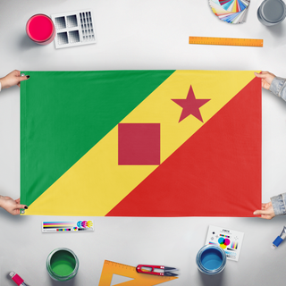 A mockup of the custom flag 'test flag' held up on a table during print checking