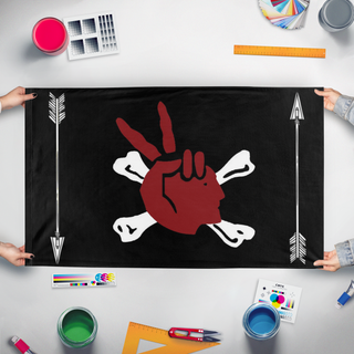 A mockup of the custom flag 'Aim Pirate flag' held up on a table during print checking