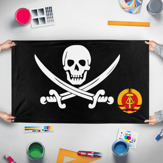 A mockup of the custom flag 'Are you away flag' held up on a table during print checking