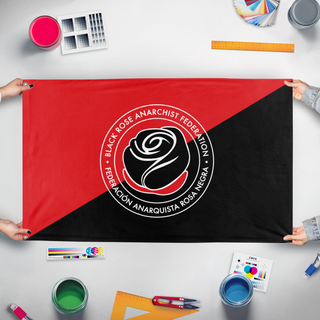 A mockup of the custom flag 'Anarchist Black Rose flag' held up on a table during print checking