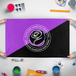 A mockup of the custom flag 'Anarchist Black Rose flag' held up on a table during print checking