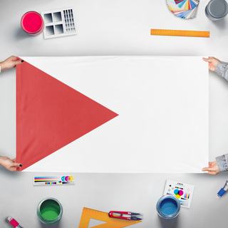 A mockup of the custom flag 'T flag' held up on a table during print checking