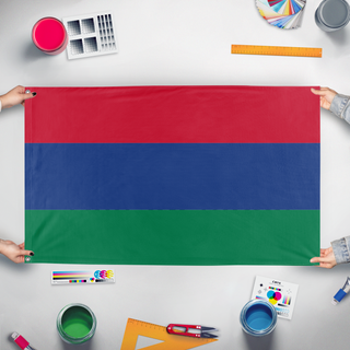 A mockup of the custom flag 'Amerianada flag' held up on a table during print checking