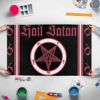 A mockup of the custom flag 'satanic revolt flag' held up on a table during print checking