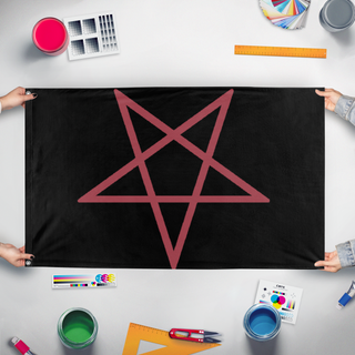 A mockup of the custom flag 'satancic flag' held up on a table during print checking