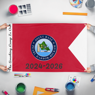 A mockup of the custom flag 'JBC Farewell Custom' held up on a table during print checking