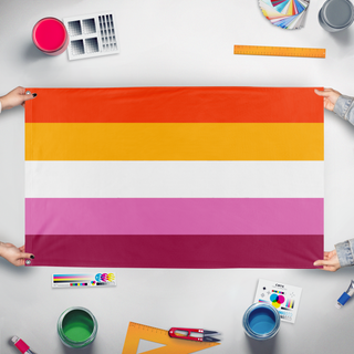 A mockup of the custom flag 'Five Stripe Lesbian Pride Flag' held up on a table during print checking