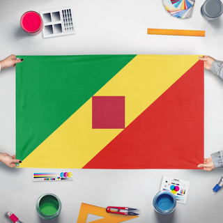 A mockup of the custom flag 'T flag' held up on a table during print checking