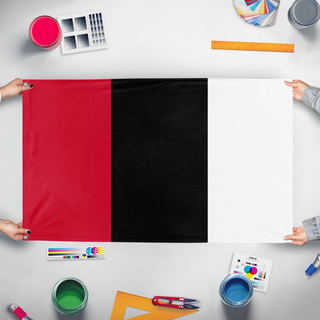 A mockup of the custom flag 'Afghanistan Tricolor flag' held up on a table during print checking