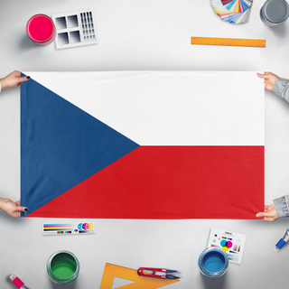 A mockup of the custom flag 'T flag' held up on a table during print checking