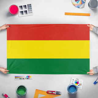 A mockup of the custom flag 'T flag' held up on a table during print checking