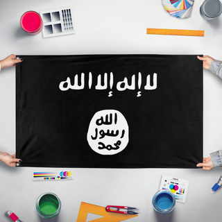 A mockup of the custom flag 'Shahadah flag' held up on a table during print checking