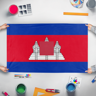 A mockup of the custom flag 'T flag' held up on a table during print checking