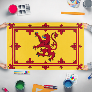 A mockup of the custom flag 'scotland flag' held up on a table during print checking