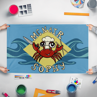 A mockup of the custom flag 'Tylers_Crab_Flag flag' held up on a table during print checking