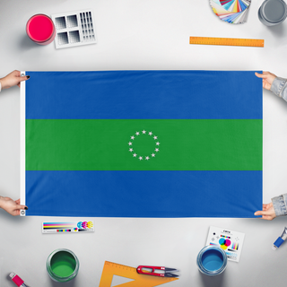 A mockup of the custom flag 'Hornes Creek flag' held up on a table during print checking