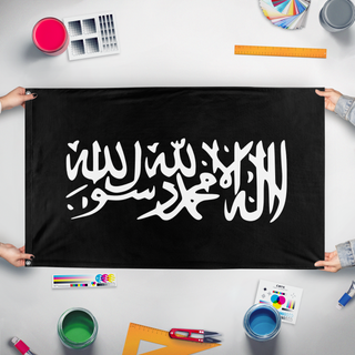 A mockup of the custom flag 'Islamic Script flag' held up on a table during print checking
