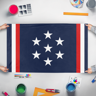 A mockup of the custom flag 'FCU flag' held up on a table during print checking