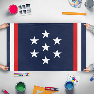 A mockup of the custom flag 'FCU flag' held up on a table during print checking