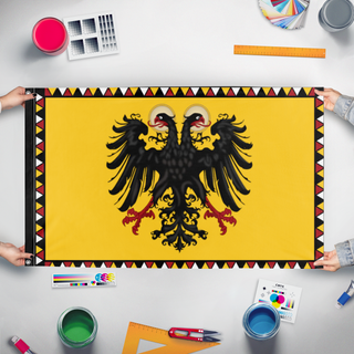 A mockup of the custom flag 'HRE flag' held up on a table during print checking